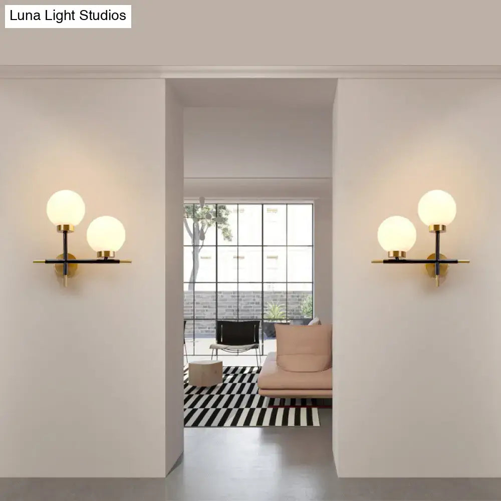Pair of White Brass Sphere Sconces with dual globe lights Decorbites on Tampa Home & Garden Store