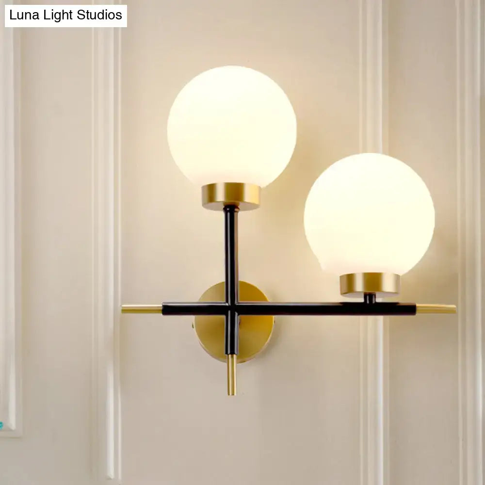 White Brass Sphere Sconce by Decorbites, double-globe wall light with frosted glass globes on Tampa Home & Garden Store