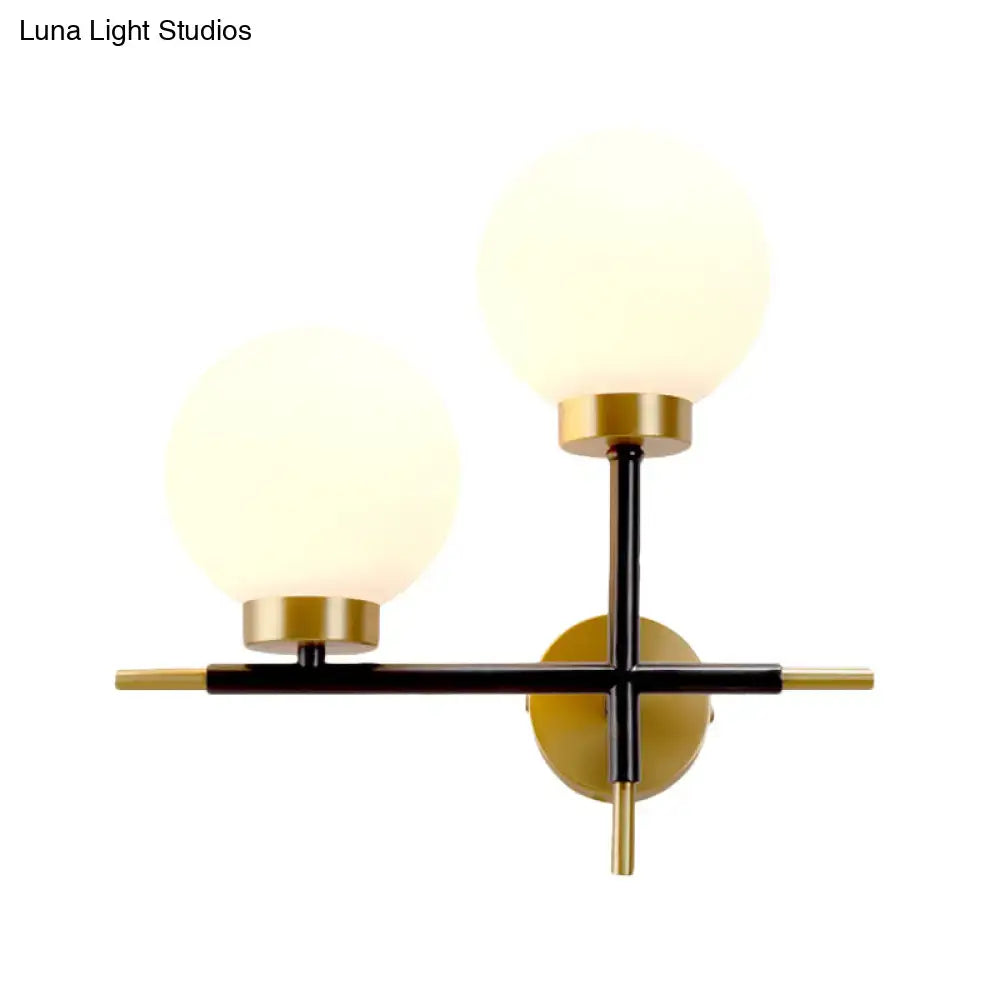 White Brass Sphere Sconce by Decorbites with two frosted globes on black and brass frame on Tampa Home & Garden Store