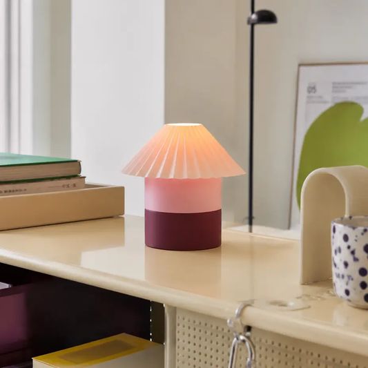 Cici Lamp small color block table lamp with pink pleated shade and purple base on a cream desk on Tampa Home & Garden Store