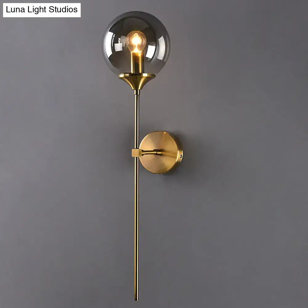 Amber Smoke Glass Wall Sconce with brass finish and glass globe by Decorbites on Tampa Home & Garden Store