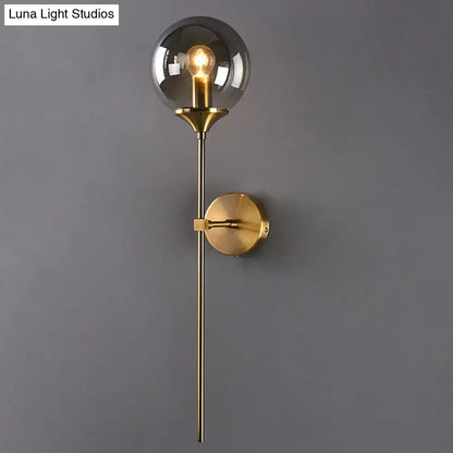 Amber Smoke Glass Wall Sconce with brass finish and glass globe by Decorbites on Tampa Home & Garden Store
