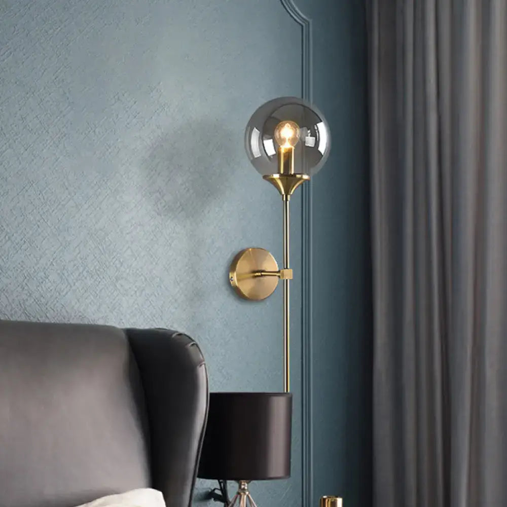 Amber smoke glass wall sconce with brass fixture and round globe, wall mounted Decorbites on Tampa Home & Garden Store