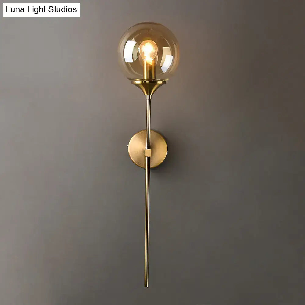 Amber Smoke Glass Wall Sconce with brass finish and glass globe by Decorbites on Tampa Home & Garden Store