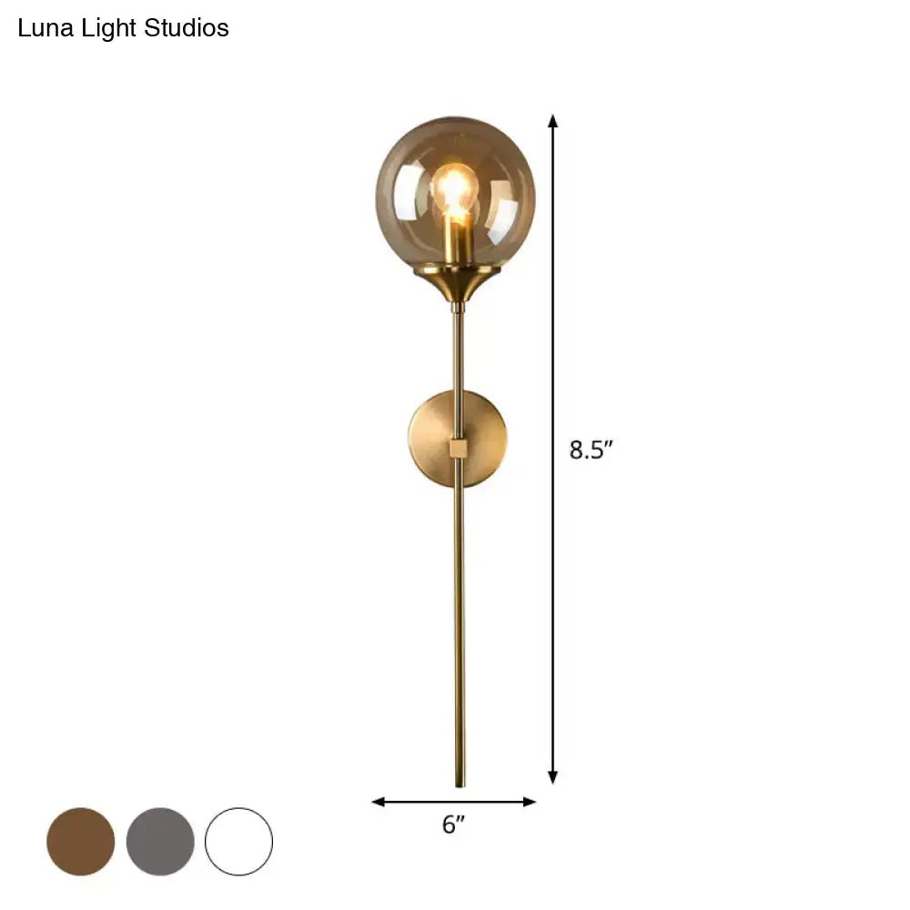 Amber Smoke Glass Wall Sconce by Decorbites in brass with round glass shade and exposed bulb on Tampa Home & Garden Store