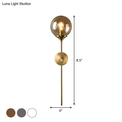 Amber Smoke Glass Wall Sconce by Decorbites in brass with round glass shade and exposed bulb on Tampa Home & Garden Store