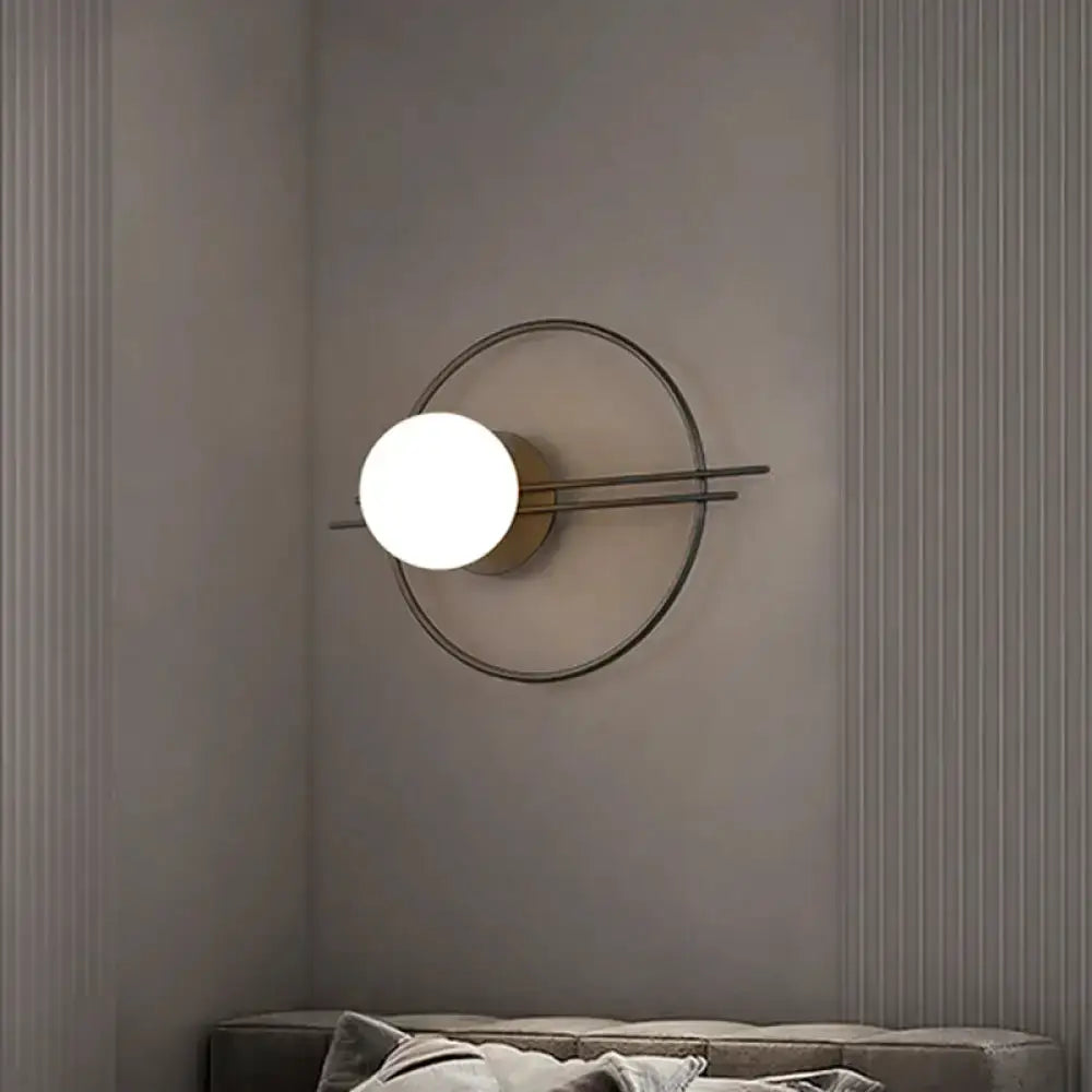 Black and Brass Sconce Light with White Glass