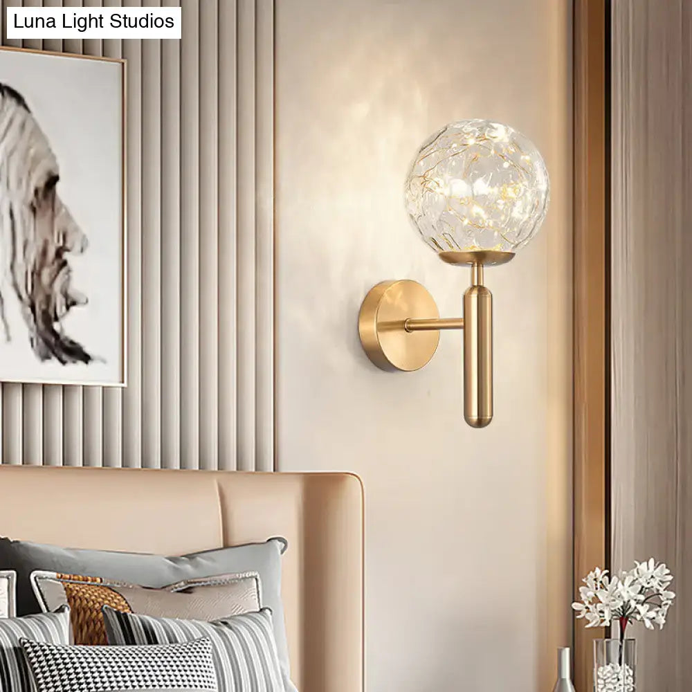 Black glass wall sconce by Decorbites with clear glass globe and brass finish on Tampa Home & Garden Store