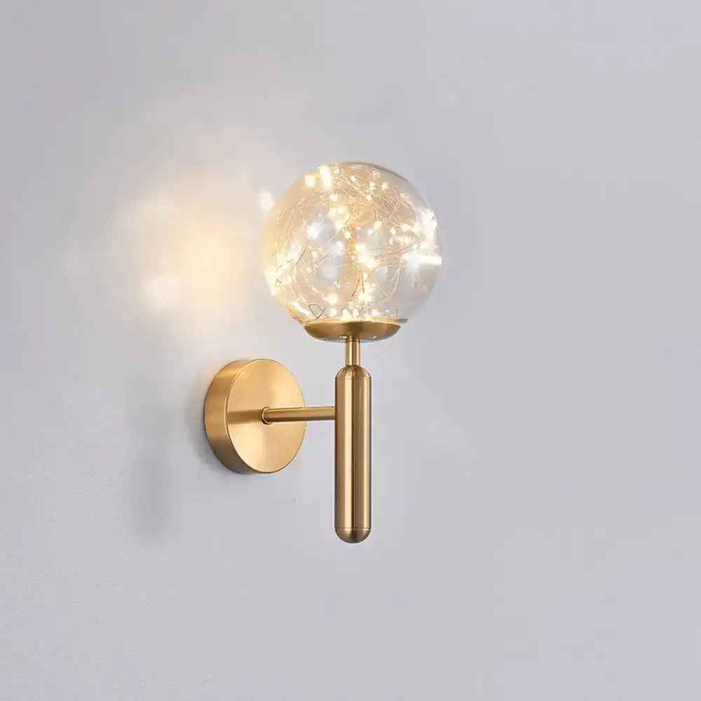 Black Glass Wall Sconce by Decorbites, brass wall mount with clear glass globe and warm lights on Tampa Home & Garden Store