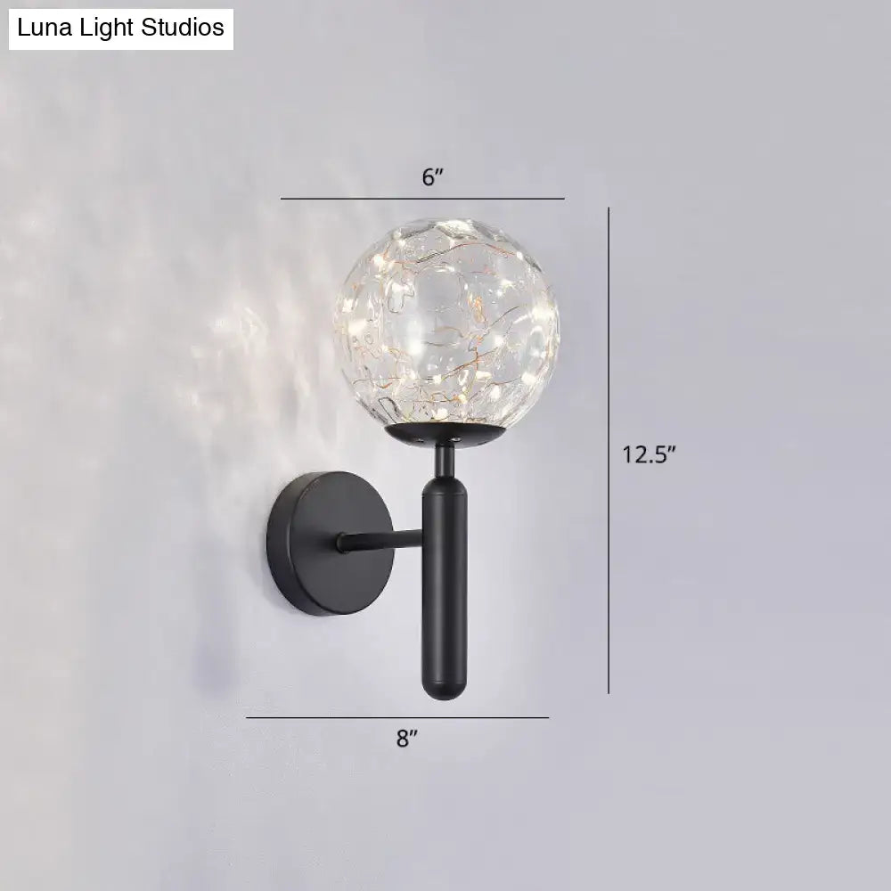 Decorbites black glass wall sconce with a 6-inch crackle glass globe on a round backplate on Tampa Home & Garden Store