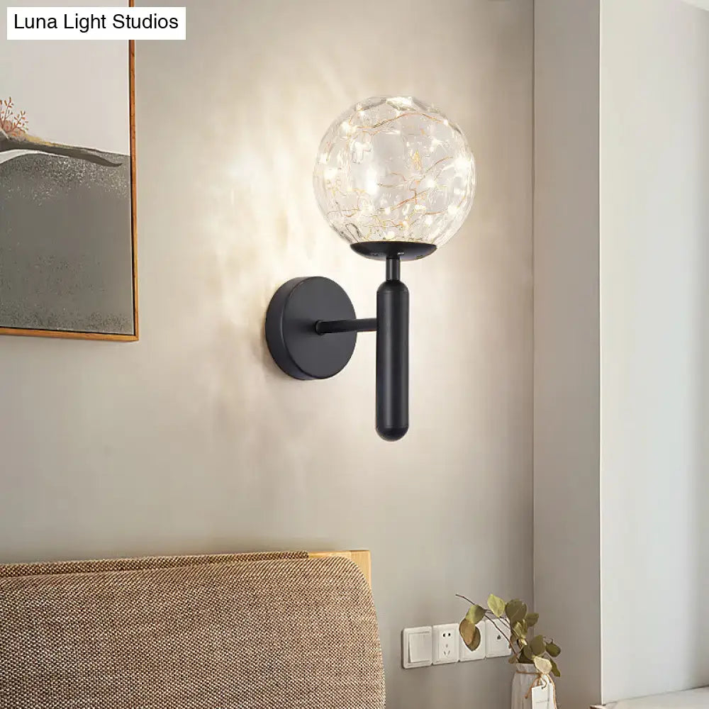 Black glass wall sconce by Decorbites with crackled globe and round backplate on Tampa Home & Garden Store