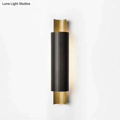 Black Gold Pipe LED Sconce by Decorbites with a black cylindrical body and gold end caps on Tampa Home & Garden Store