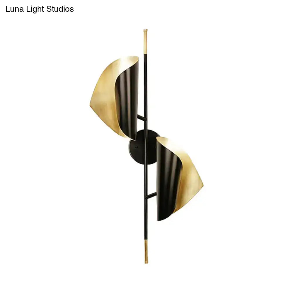 Black Gold Ribbed Leaf Wall Light by Decorbites; dual gold leaf shades on black vertical sconce on Tampa Home & Garden Store
