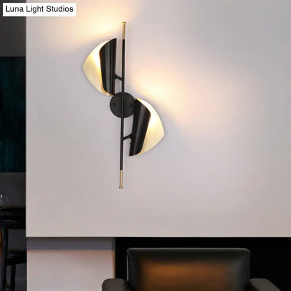 Black Gold Ribbed Leaf Wall Light wall sconce with dual leaf shades and warm glow on Tampa Home & Garden Store