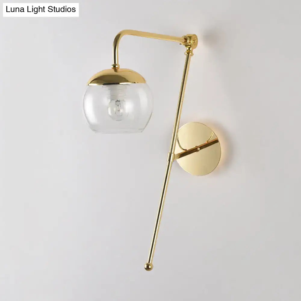 Black Glass Swing Arm Sconce by Decorbites, brass finish with clear glass globe, wall-mounted on Tampa Home & Garden Store