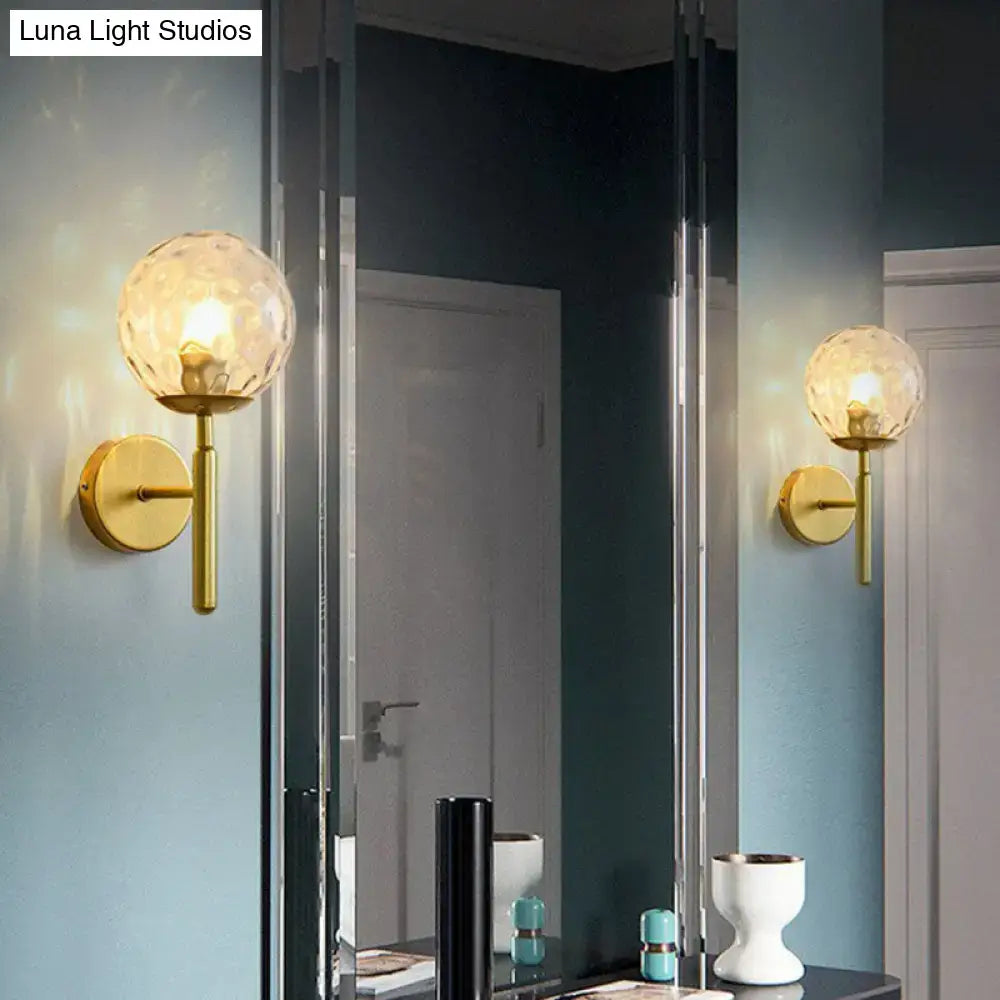 Decorbites postmodern black gold wall sconce pair with glass globe lights on brass mounts on Tampa Home & Garden Store