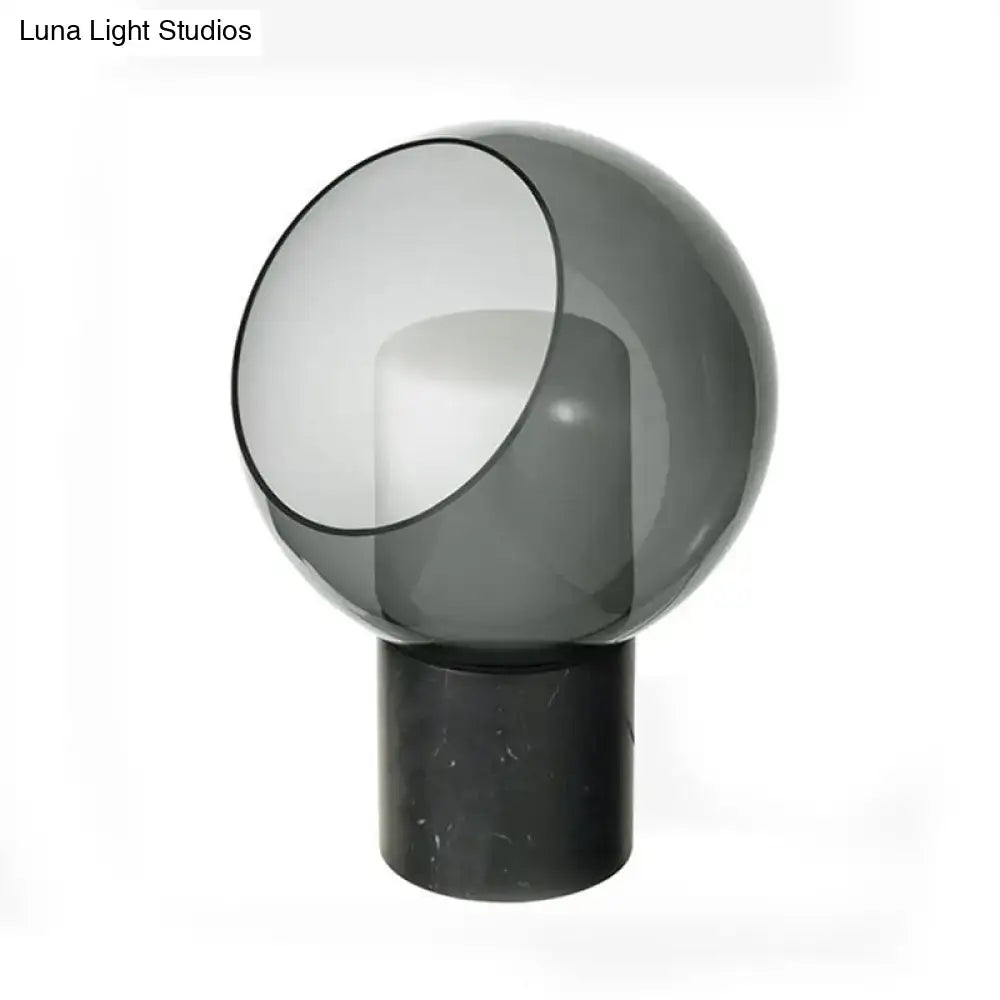 Black Marble Table Lamp by Decorbites with smoky gray glass globe atop a black marble base on Tampa Home & Garden Store