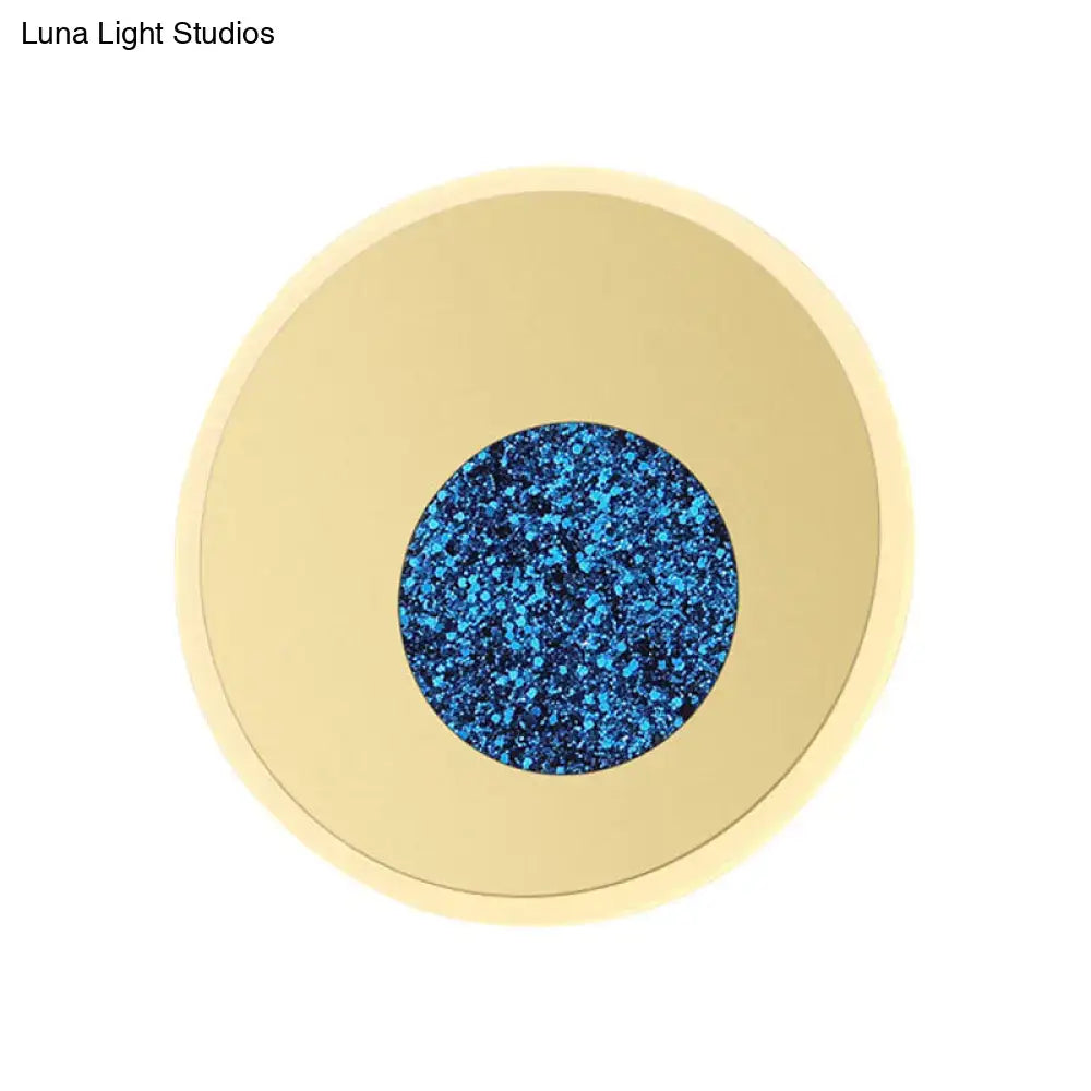 Blue round wall sconce by Decorbites with gold-tone outer ring and speckled blue center on Tampa Home & Garden Store