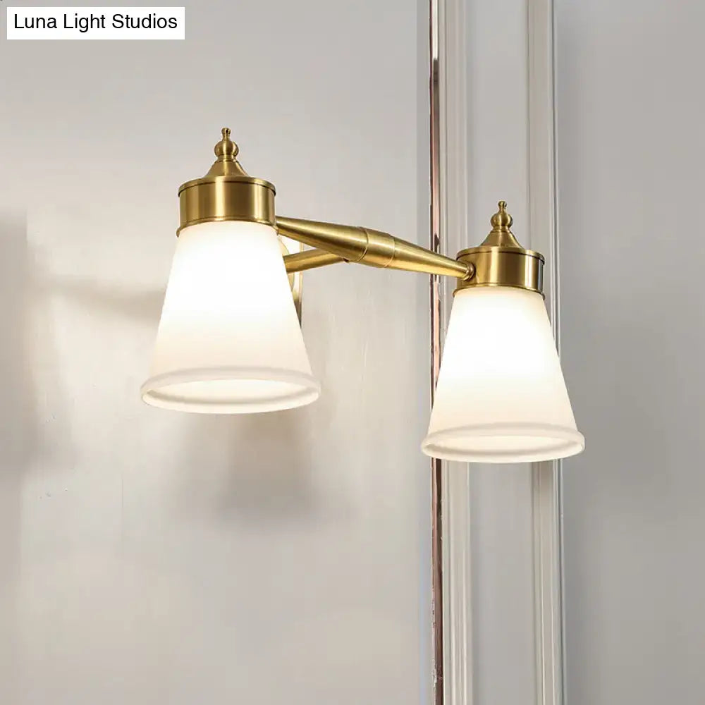 Brass cream glass vanity light, dual lamps with cream shades and gold finish, wall-mounted on Tampa Home & Garden Store