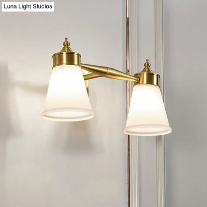 Brass cream glass vanity light, dual lamps with cream shades and gold finish, wall-mounted on Tampa Home & Garden Store