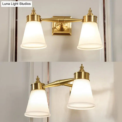 Brass cream glass vanity light, Decorbites dual-light fixture with frosted shades on Tampa Home & Garden Store