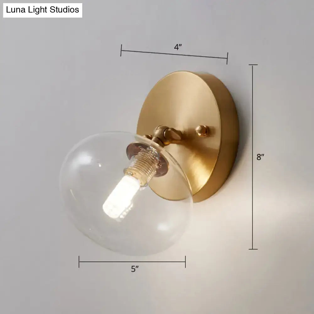 Brass Glass Wall Sconce by Decorbites with clear glass globe and exposed bulb 8in tall on Tampa Home & Garden Store