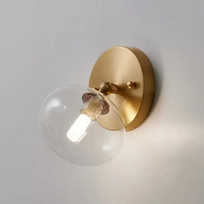 Brass glass wall sconce with clear globe bulb, Decorbites on Tampa Home & Garden Store