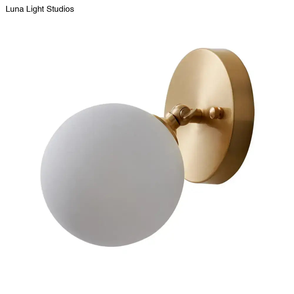 Brass glass wall sconce with frosted globe, gold backplate, Decorbites on Tampa Home & Garden Store