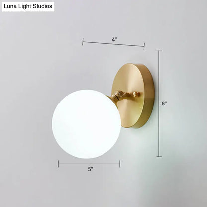 Brass glass wall sconce with white globe, Decorbites on Tampa Home & Garden Store