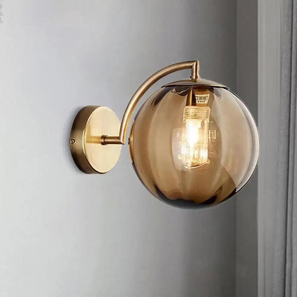 Brass Amber Ball Sconce by Decorbites, single-light wall light with amber glass globe on Tampa Home & Garden Store