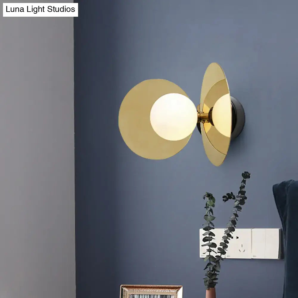 Brass Milk Glass Sconce by Decorbites; wall mount with overlapping circular discs and white globe on Tampa Home & Garden Store