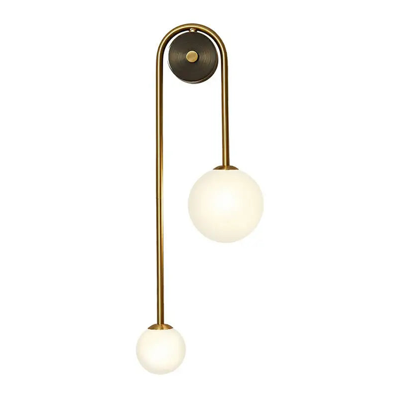 Brass opal glass wall sconce by Decorbites with dual globe shades, gold finish on Tampa Home & Garden Store
