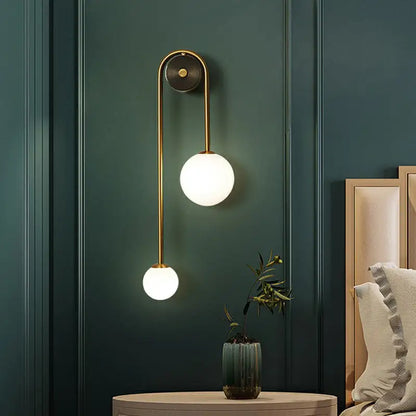 Brass opal glass wall sconce, vertical double-arm design featuring 2 globe lights Decorbites on Tampa Home & Garden Store