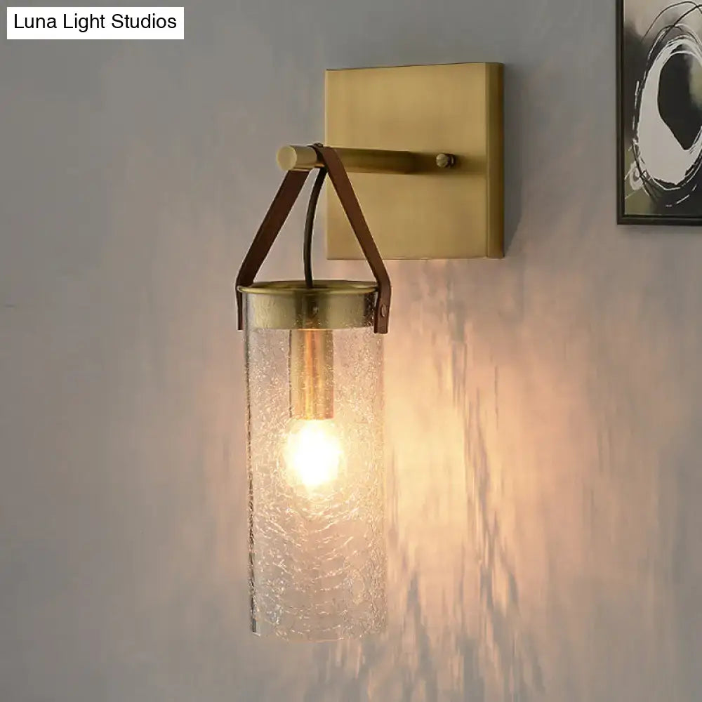 Brass crack glass sconce with brown leather strap by Decorbites; wall-mounted glass shade on Tampa Home & Garden Store