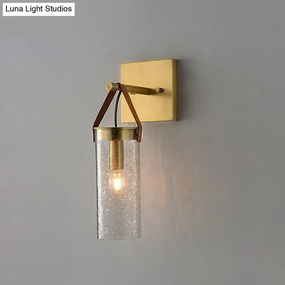 Brass Crack Glass Sconce with crackled glass cylinder shade and gold backplate on Tampa Home & Garden Store