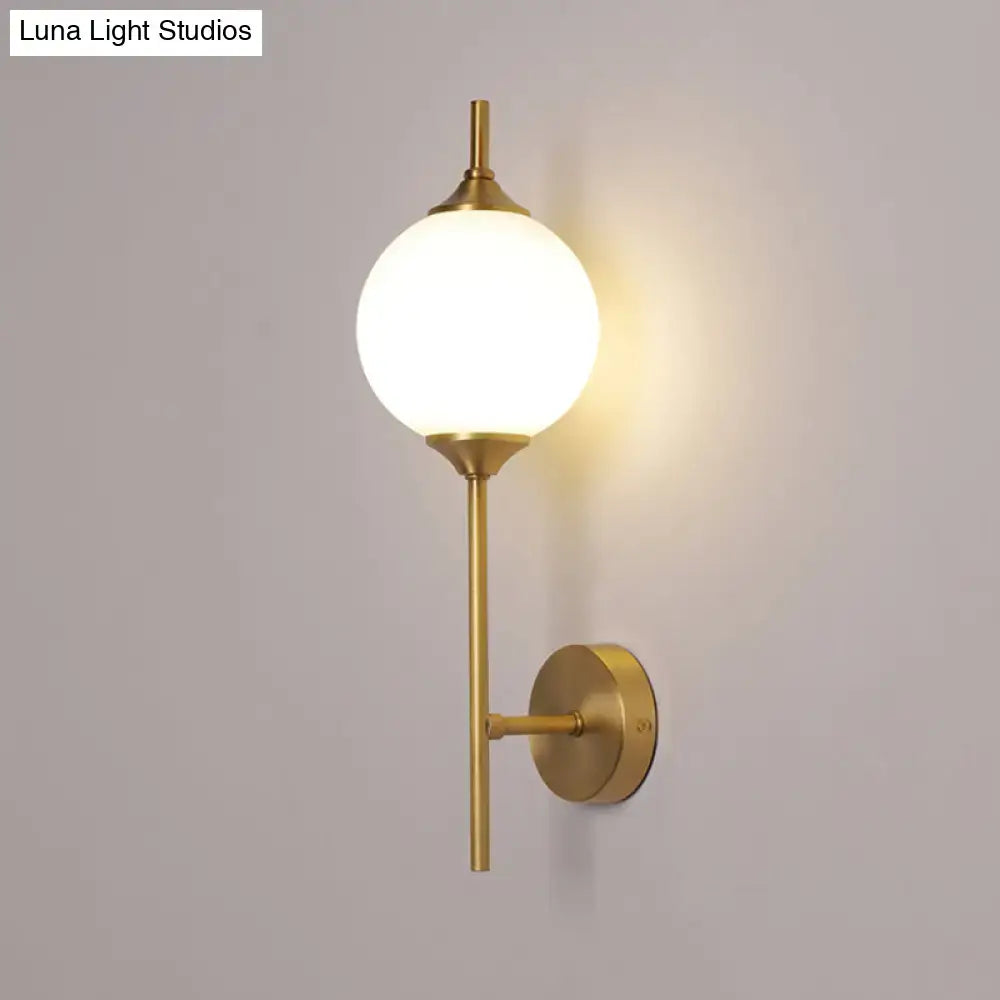 Brass geometric glass sconce with a white globe Decorbites wall light on Tampa Home & Garden Store