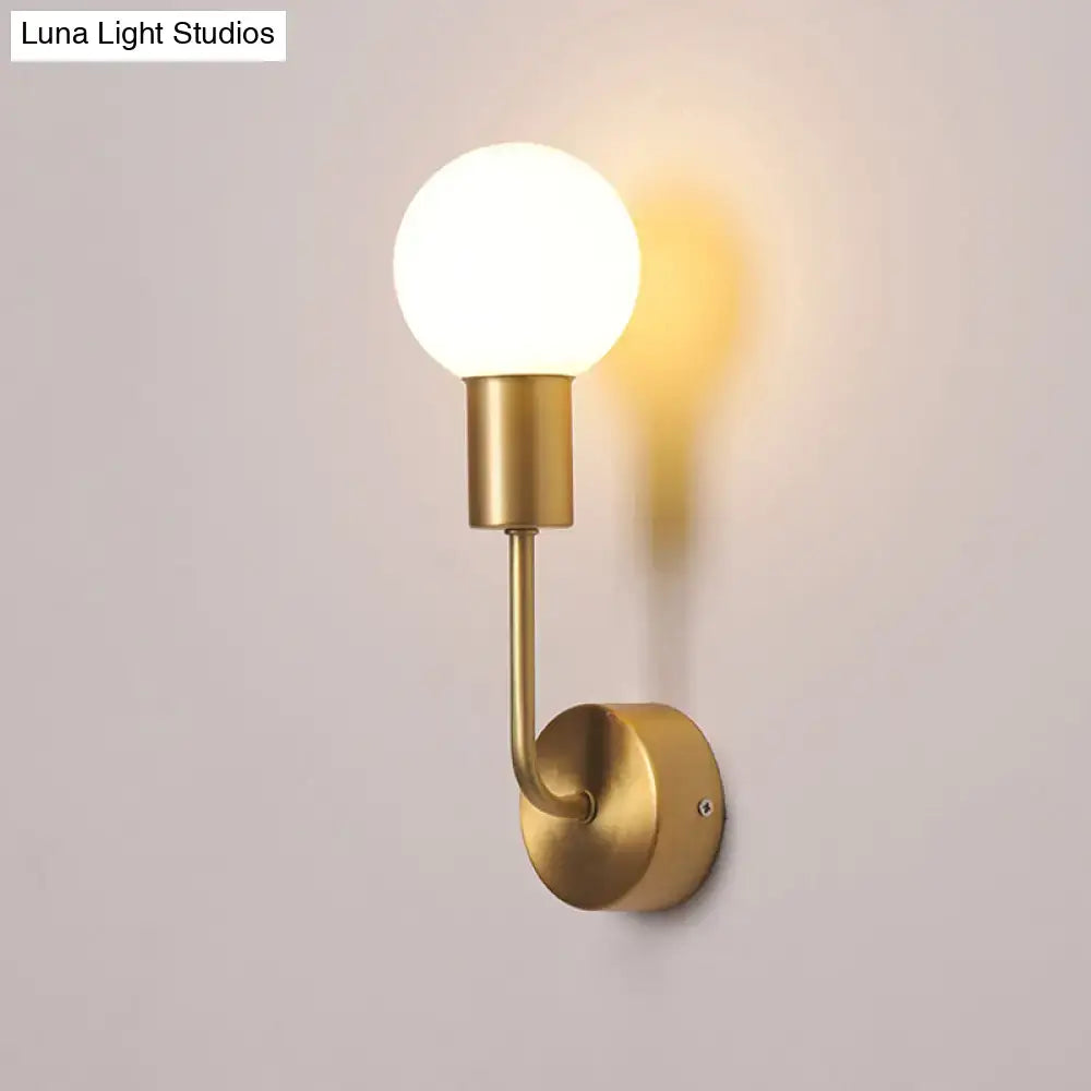 Brass Geometric Glass Sconce by Decorbites, wall-mounted with a round white glass globe on Tampa Home & Garden Store