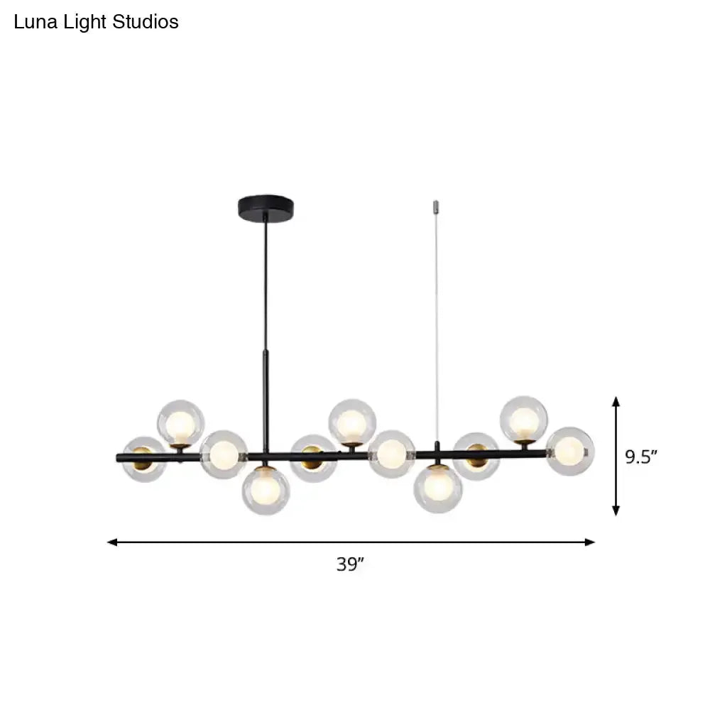 Decorbites glass ball pendant light, black metal bar with frosted globes and brass accents on Tampa Home & Garden Store