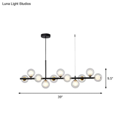 Decorbites glass ball pendant light, black metal bar with frosted globes and brass accents on Tampa Home & Garden Store
