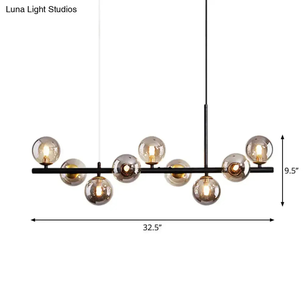 Postmodern glass ball pendant light by Decorbites with brass frosted-glass globes on a black bar on Tampa Home & Garden Store