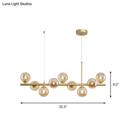Postmodern glass ball pendant light for kitchen with brass frame and frosted globes, 32.5in span on Tampa Home & Garden Store