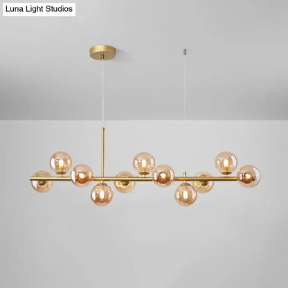 Decorbites postmodern glass ball pendant light with brass finish and frosted glass spheres on Tampa Home & Garden Store