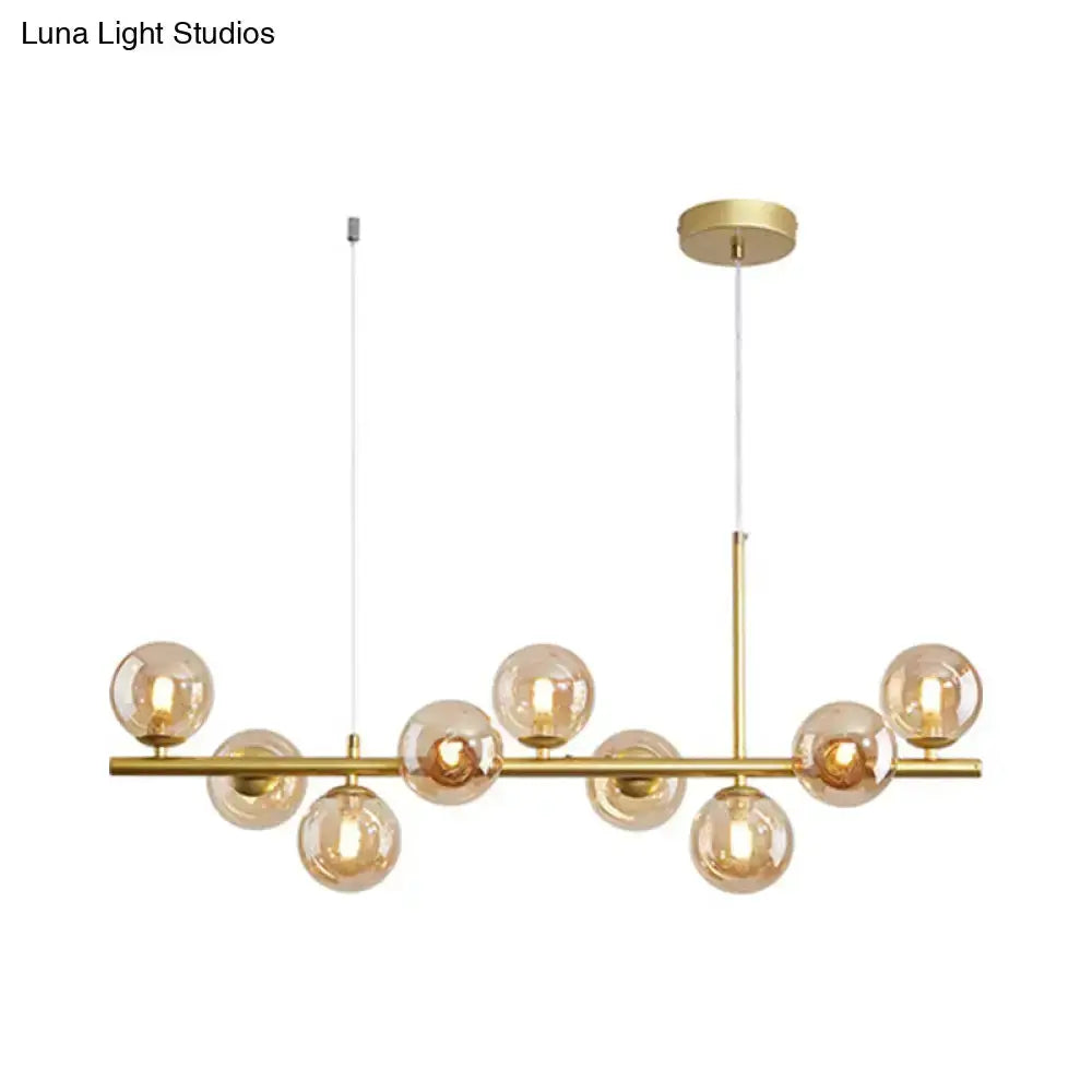 Postmodern brass glass ball pendant light with multiple clear globes for kitchen on Tampa Home & Garden Store
