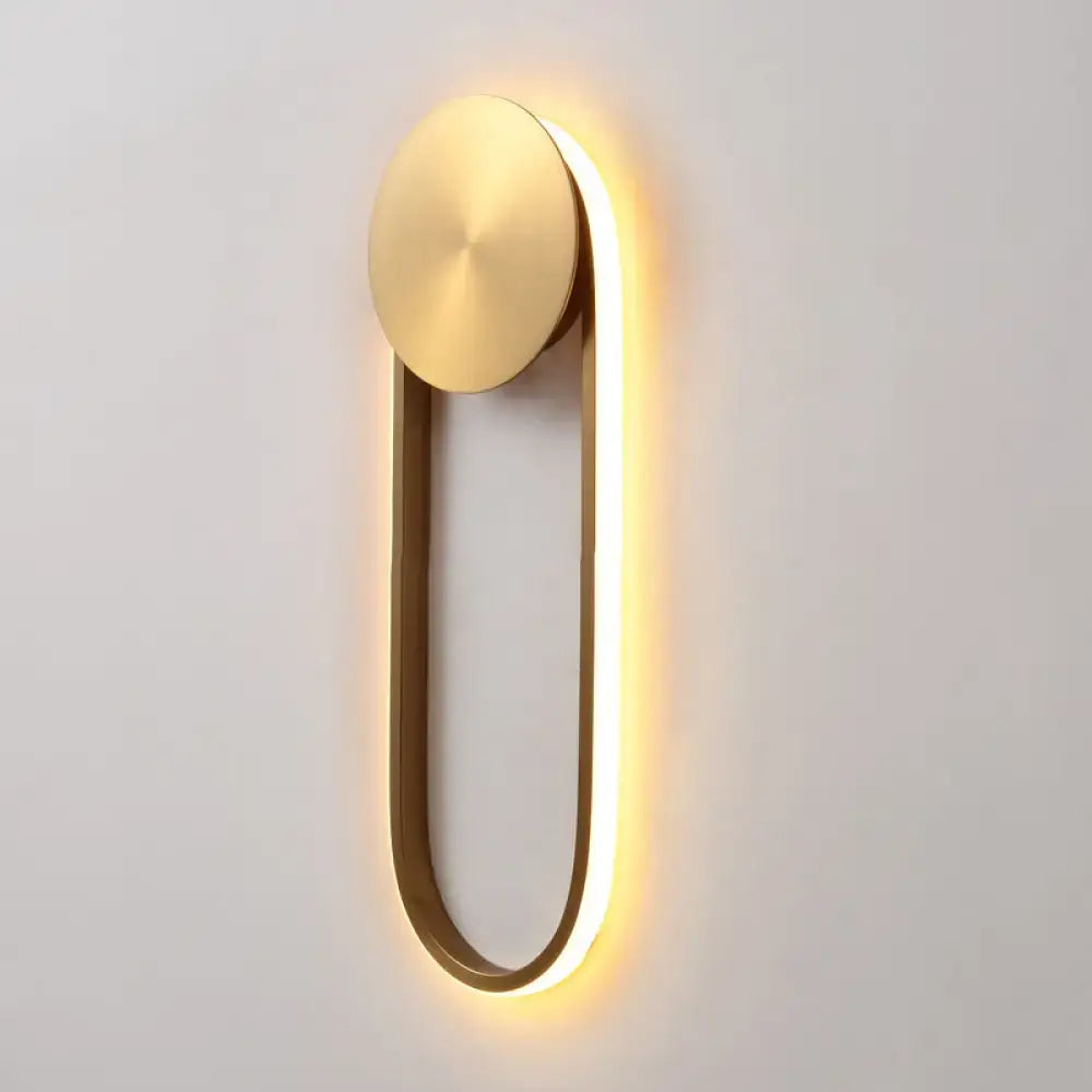 Brass Arc Wall Lamp by Decorbites with warm LED glow along a rounded U-shaped brass frame on Tampa Home & Garden Store