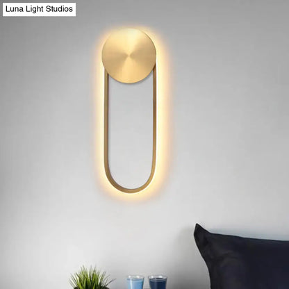 Brass Arc Wall Lamp Decorbites; wall-mounted sconce with circular backplate and warm LED arc glow on Tampa Home & Garden Store