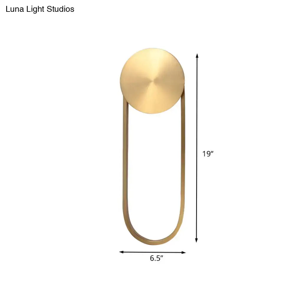 Brass arc wall lamp with a round backplate and curved U-arm by Decorbites on Tampa Home & Garden Store