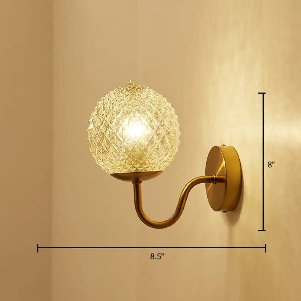 Decorbites gold textured glass ball wall sconce with brass curved arm, 1-light on Tampa Home & Garden Store