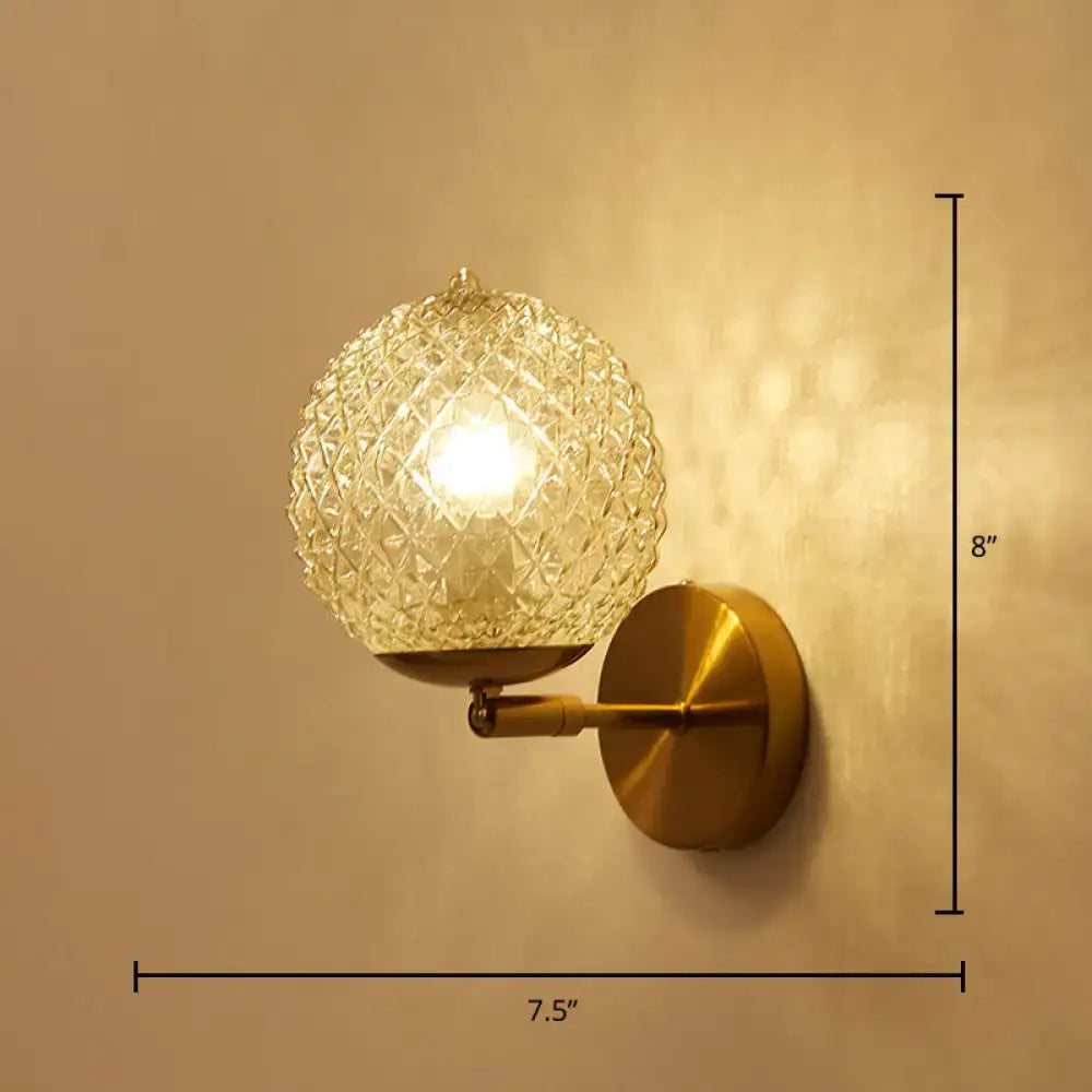 Gold textured glass ball wall sconce with brass mount and arm, 8in tall, 7.5in wide on Tampa Home & Garden Store
