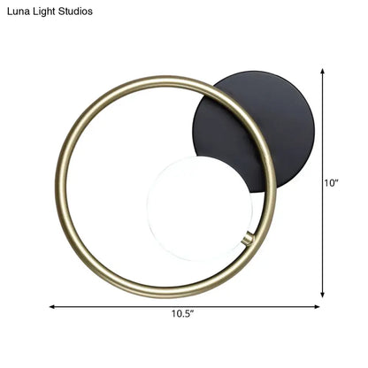 Gold ring industrial wall sconce with black backplate and white globe by Decorbites on Tampa Home & Garden Store