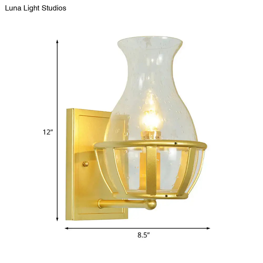 Gold Clear Glass Wall Lamp sconce with hurricane glass shade and lantern cage by Decorbites on Tampa Home & Garden Store